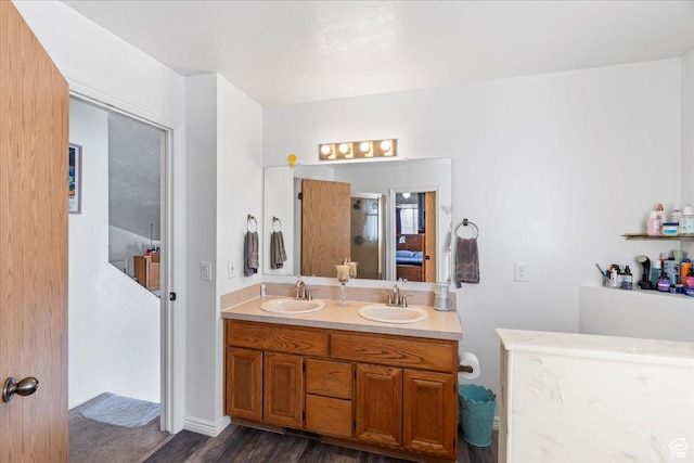 1107 E 2450 N, Layton, UT 84040 - full bathroom with a shower, wood finished floors, double vanity, and a sink