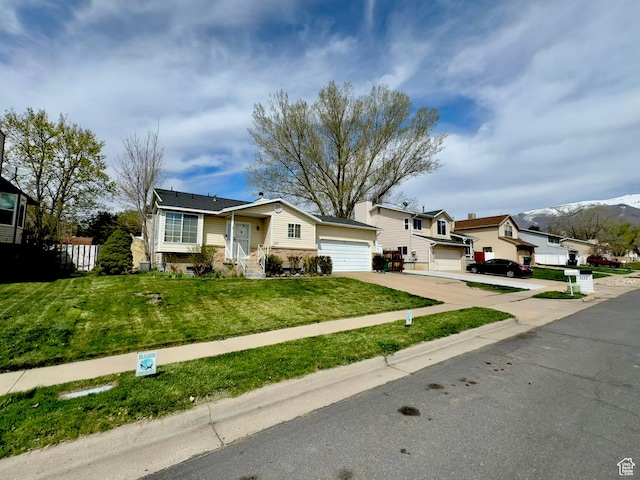 1107 E 2450 N, Layton, UT 84040 - view of front of property featuring a garage, stone siding, a front lawn, driveway, and a residential view