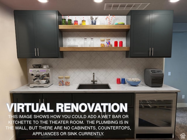 kitchen with backsplash, open shelves, visible vents, wine cooler, and a sink