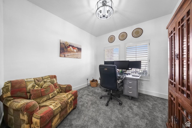 home office featuring baseboards, dark colored carpet, and a chandelier