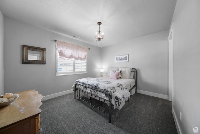 bedroom with a notable chandelier, visible vents, baseboards, and dark carpet