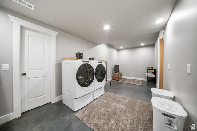 clothes washing area with baseboards, recessed lighting, visible vents, laundry area, and washer and dryer