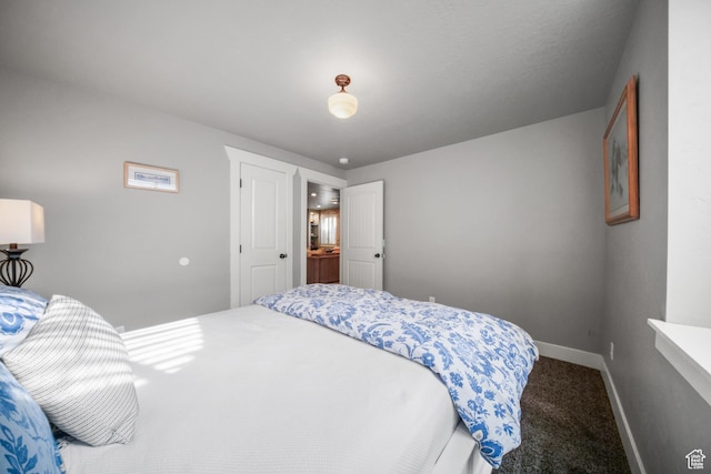 bedroom with carpet and baseboards