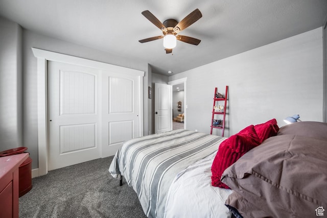 bedroom featuring a closet, a ceiling fan, and carpet flooring