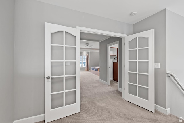 hall with carpet floors and baseboards