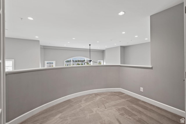 carpeted empty room with recessed lighting and baseboards