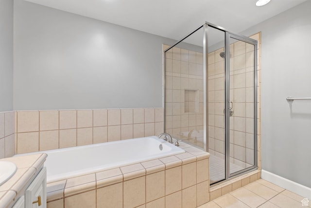 full bath with a shower stall, tile patterned floors, and a bath
