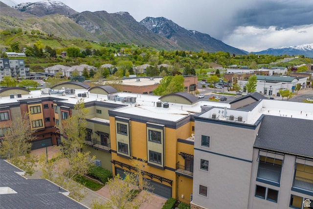 birds eye view of property with a mountain view and a residential view