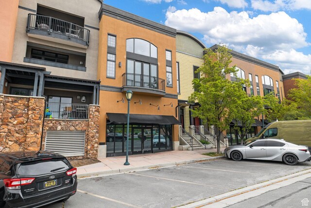 view of property featuring uncovered parking