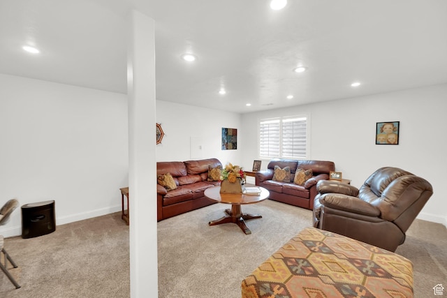 carpeted living area with baseboards and recessed lighting