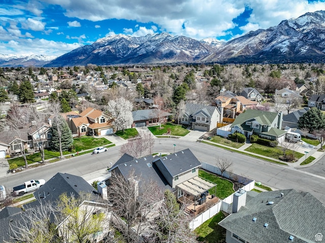 birds eye view of property with a residential view and a mountain view