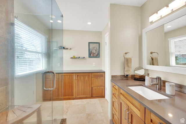 full bathroom featuring recessed lighting, vanity, and a stall shower