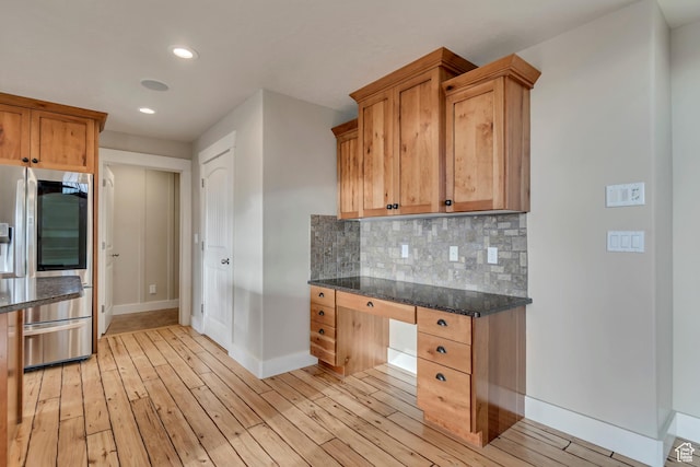 1135 Grandview Dr, Providence, UT 84332 - kitchen with stainless steel refrigerator with ice dispenser, built in desk, light wood-style flooring, backsplash, and recessed lighting