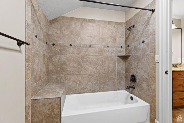 bathroom with bathing tub / shower combination and vanity