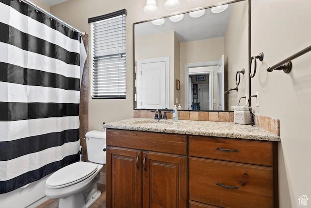 full bath featuring curtained shower, vanity, and toilet