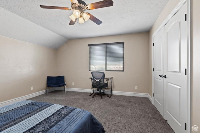 carpeted bedroom with baseboards, a textured ceiling, vaulted ceiling, and a ceiling fan