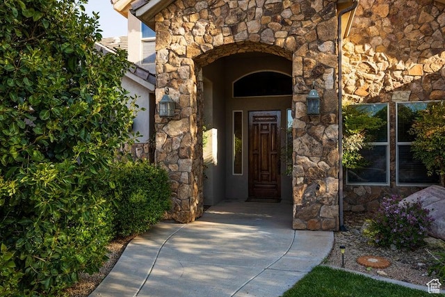 view of exterior entry with stone siding