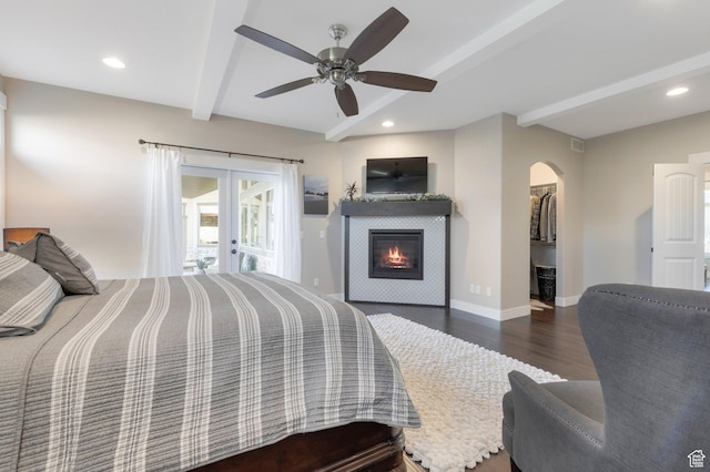 1737 E 6850 S, Uintah, UT 84405 - bedroom featuring beam ceiling, french doors, wood finished floors, arched walkways, and a spacious closet