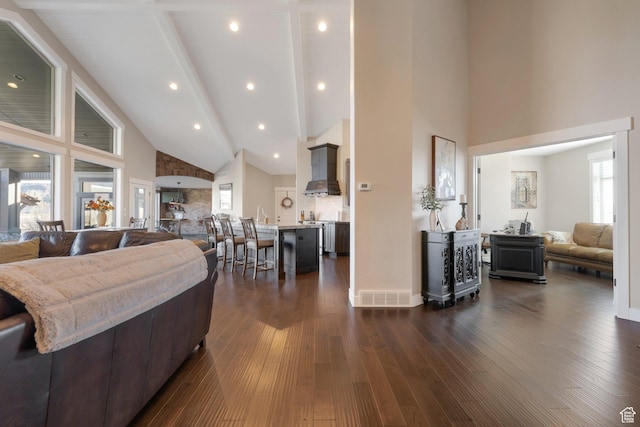 1737 E 6850 S, Uintah, UT 84405 - living area featuring high vaulted ceiling, dark wood finished floors, beam ceiling, and baseboards