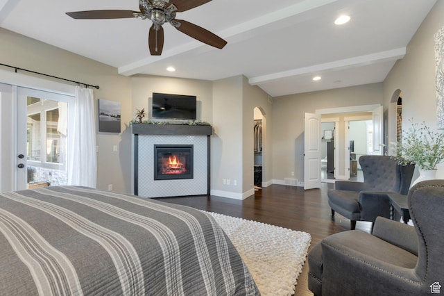 1737 E 6850 S, Uintah, UT 84405 - bedroom with arched walkways, wood finished floors, beamed ceiling, a fireplace, and baseboards