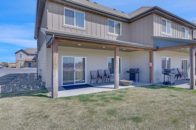 140 W 150 S Unit 22, Garden City, UT 84028 - rear view of house with board and batten siding, a patio, and a yard