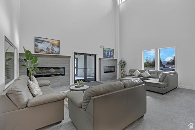 140 W 150 S Unit 22, Garden City, UT 84028 - carpeted living area with a fireplace, a high ceiling, and baseboards