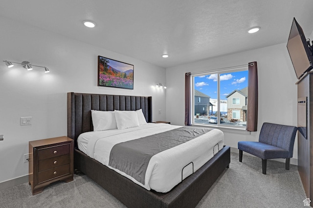 140 W 150 S Unit 22, Garden City, UT 84028 - bedroom with light carpet, baseboards, and recessed lighting