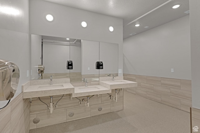 140 W 150 S Unit 22, Garden City, UT 84028 - full bath featuring recessed lighting, tile walls, and vanity