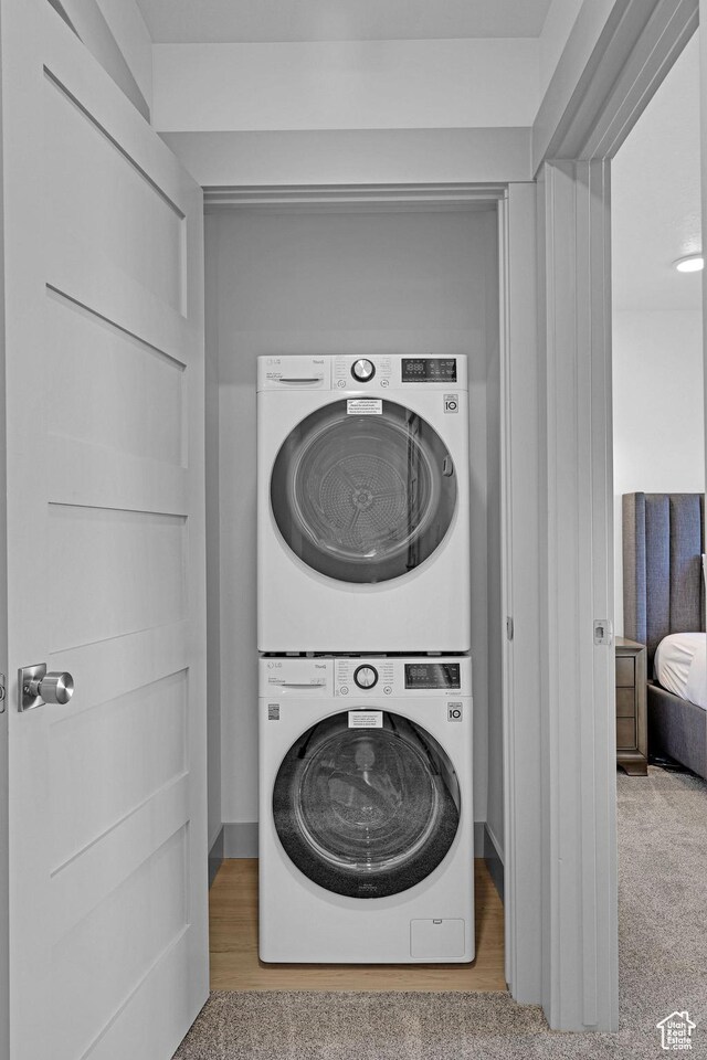 140 W 150 S Unit 22, Garden City, UT 84028 - washroom with stacked washer and clothes dryer and carpet floors