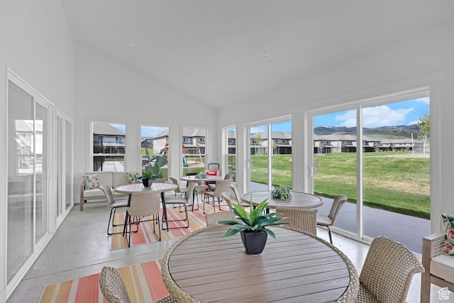 140 W 150 S Unit 22, Garden City, UT 84028 - sunroom / solarium with outdoor dining space, high vaulted ceiling, a residential view, and speckle patterned floor
