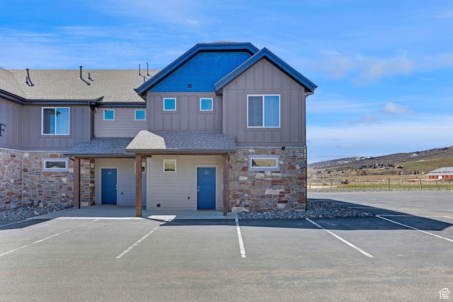 140 W 150 S Unit 22, Garden City, UT 84028 - multi unit property featuring board and batten siding, stone siding, uncovered parking, and a shingled roof