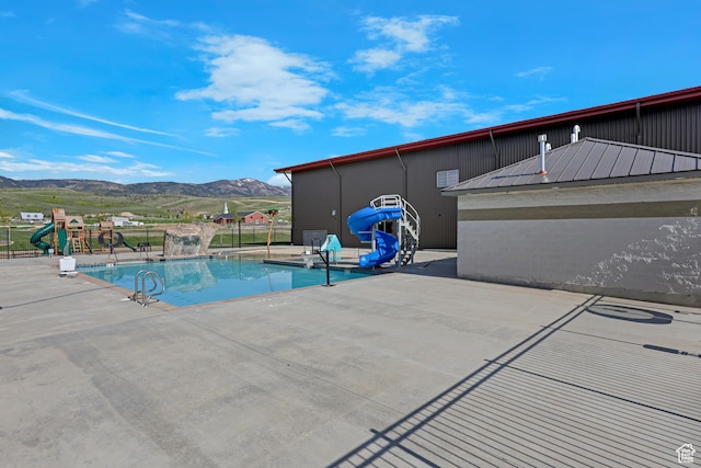 140 W 150 S Unit 22, Garden City, UT 84028 - community pool with a water slide, a mountain view, and a patio area