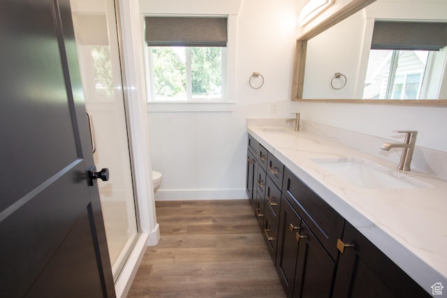 198 N 600 E, Hyrum, UT 84319 - bathroom featuring a sink, toilet, double vanity, and wood finished floors