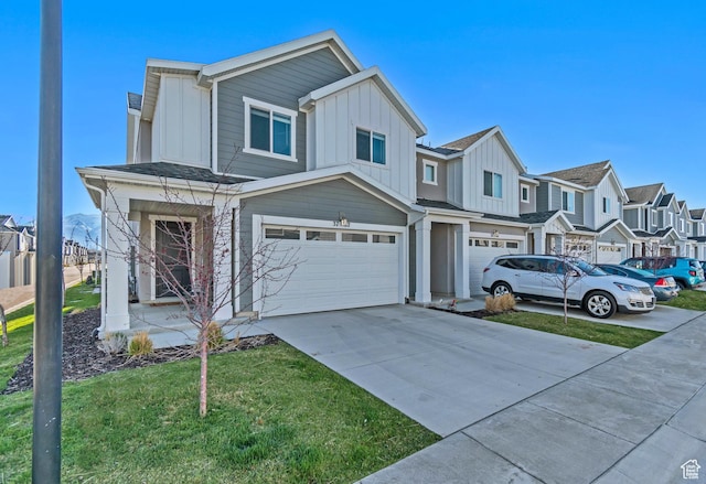 view of front of home with board and batten siding, an attached garage, a residential view, and driveway