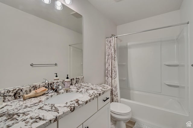 bathroom with shower / tub combo, toilet, and vanity