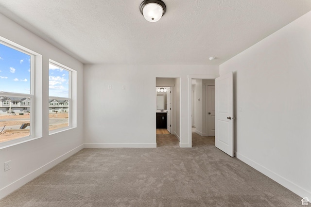 516 W Olive Ln, St George, UT 84790 - carpeted empty room with baseboards and a textured ceiling