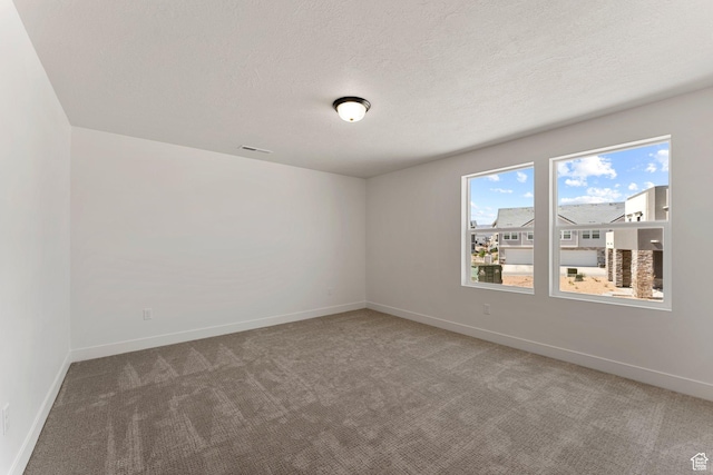 516 W Olive Ln, St George, UT 84790 - carpeted empty room with baseboards and a textured ceiling