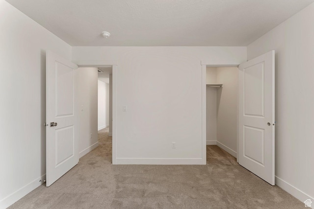 516 W Olive Ln, St George, UT 84790 - unfurnished bedroom with light colored carpet, a spacious closet, and a closet