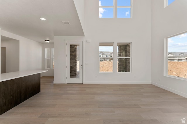 516 W Olive Ln, St George, UT 84790 - foyer entrance featuring light wood-style flooring, plenty of natural light, a high ceiling, and recessed lighting