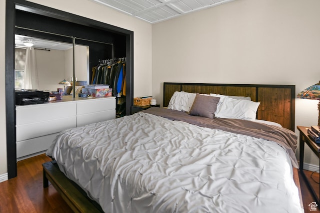 bedroom featuring a closet and wood finished floors