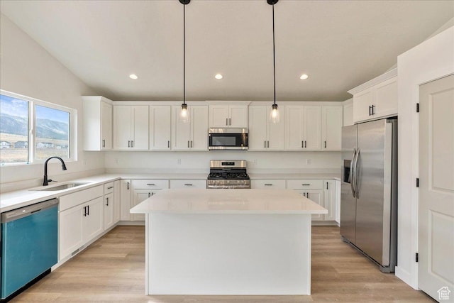 2329 E Woodbury Ln, Eagle Mountain, UT 84005 - kitchen featuring a sink, light wood finished floors, white cabinetry, and stainless steel appliances