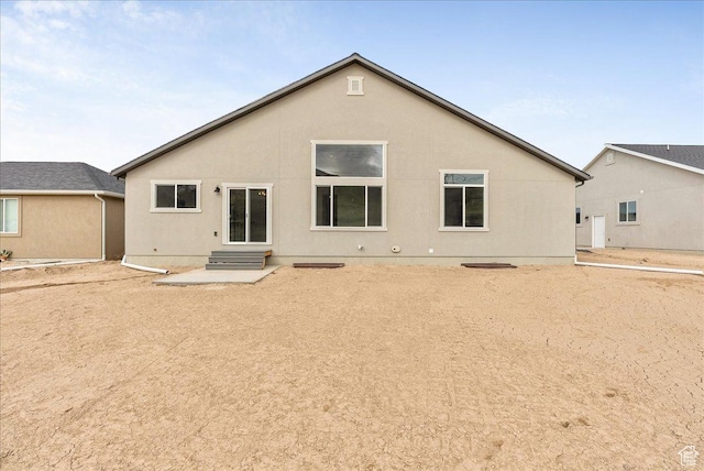 2329 E Woodbury Ln, Eagle Mountain, UT 84005 - rear view of house with entry steps