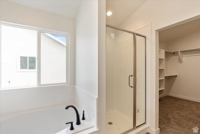 2329 E Woodbury Ln, Eagle Mountain, UT 84005 - full bath with a walk in closet, a bath, a shower stall, and recessed lighting