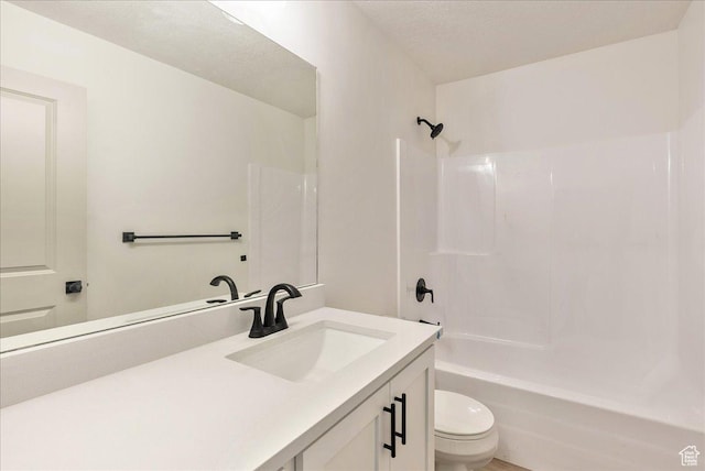 2329 E Woodbury Ln, Eagle Mountain, UT 84005 - bathroom featuring toilet, a textured ceiling, vanity, and  shower combination