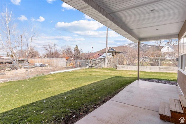 view of yard featuring a patio area and a fenced backyard