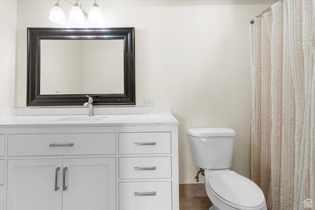 full bathroom featuring toilet and vanity