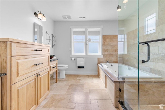 full bathroom featuring tiled shower, vanity, toilet, a jetted tub, and baseboards