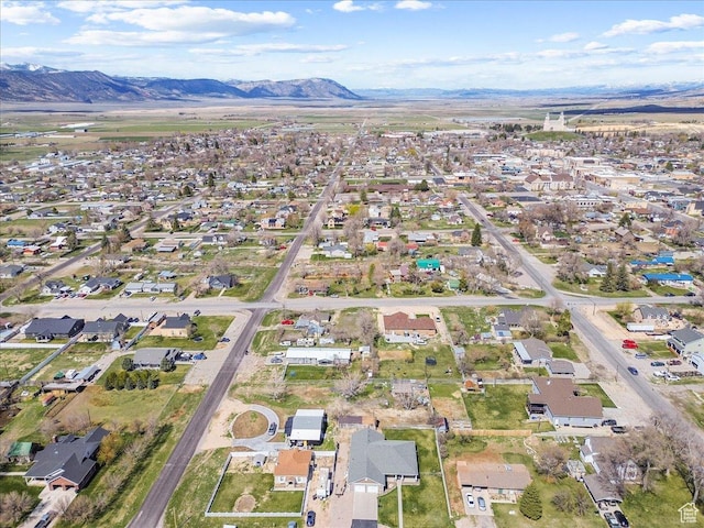 drone / aerial view featuring a residential view and a mountain view