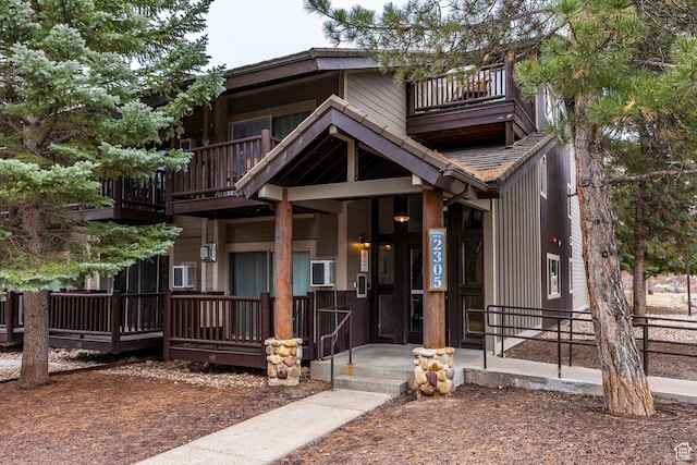 view of front of property with a balcony and covered porch