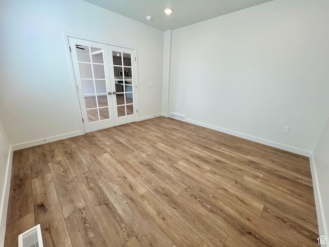 6293 W Jackson Crest Way, Herriman, UT 84096 - empty room featuring light wood-style floors, french doors, baseboards, and visible vents